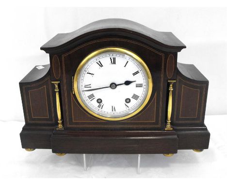 An Edwardian mantle clock, the enamel dial with roman numerals, in inlaid mahogany case, 34cm wide. 
