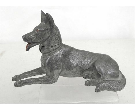 An aluminium table top petrol cigarette lighter in the form of a recumbent Alsatian, 16cm long.  