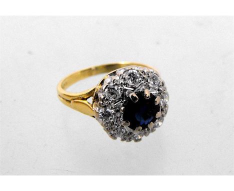 An 18ct yellow gold diamond and sapphire cluster ring 