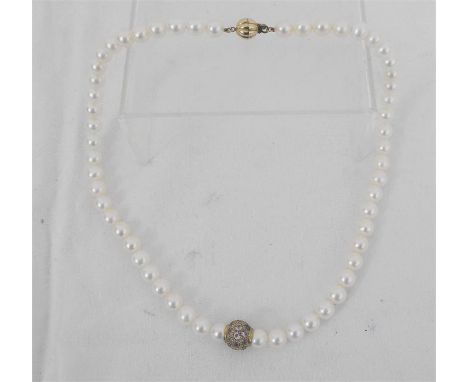 A string of cultured pearls with amethyst set bead and 9 carat gold clasp, 45cm total length.  