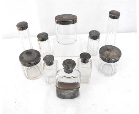 Ten silver topped jars and bottles including a hip flask 