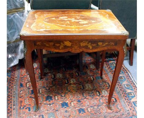 A Continental inlaid fold-over games table with single drawer, lined for backgammon, with ormalu mounts, 73cm x 54cm.