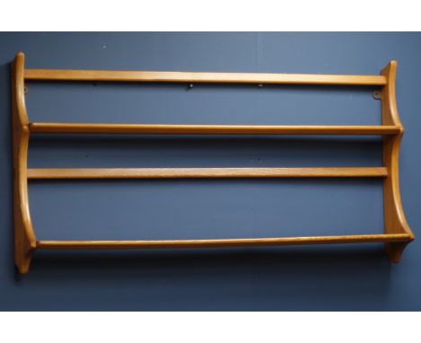 Ercol light elm two tier wall rack. W97cm   Condition Report   Click here for further images, condition, auction times & deli