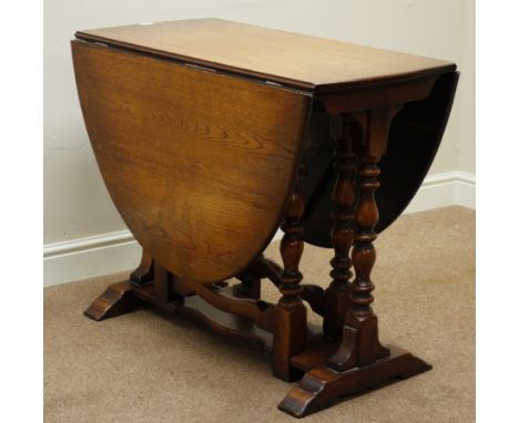 Mid 20th century oak oval drop leaf dining table, on turned double gate leg base, 91cm x 150cm, H77cm   Condition Report   Cl