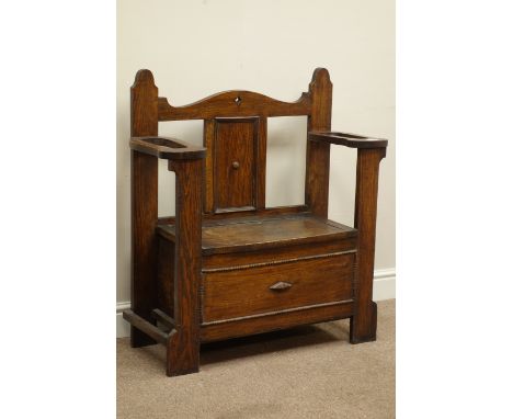 Early 20th century oak hall bench, with hinged seat, umbrella and stick stands, W85cm, H92cm, D34cm   Condition Report   Clic