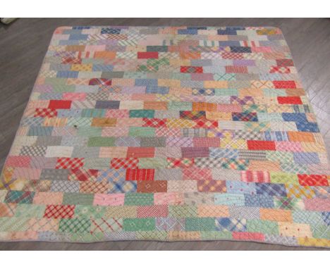 American quilt 1900-1935, "Brick" design, strong pastel colours, some reds, mainly geometric patterns, 190cm x 165cm approx,,