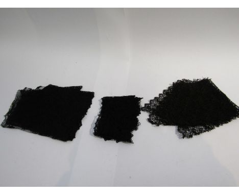 A large black lace collar (probably Victorian).  Embossed button at front with A. Pagny, Paris stamped detail.  Also two coll