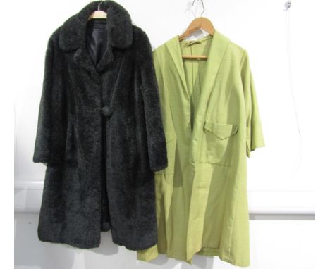A 1960's grey faux fur coat with a large bobble button cross over fastening and a 1950's pale green textured fabric coat,  tw