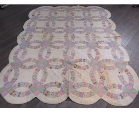 American quilt 1900-1935, cotton, "Wedding Band"design, scalloped edge,pastel colours,180cm x 220cm, overall good condition w