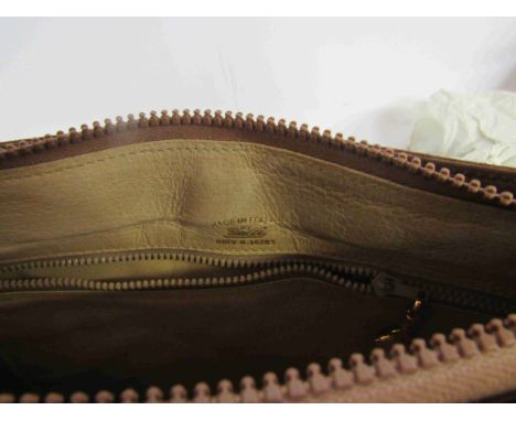 GUCCI 1970's brown velvety suede shoulder bag which is perfectly sized. The suede bag features a vintage G grid yellow metal 