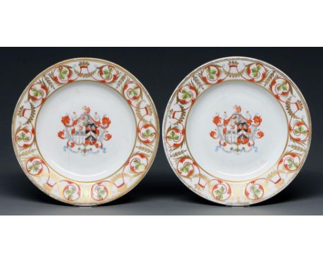 A pair of Derby armorial plates, c1820, enamelled with the arms of Collinson impaling Sowerby, 26cm diam, red painted mark  C