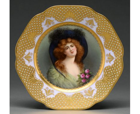 A Vienna style plate, early 20th century,&nbsp;painted by Wagner, signed, with a raven haired young woman in a green dress wi