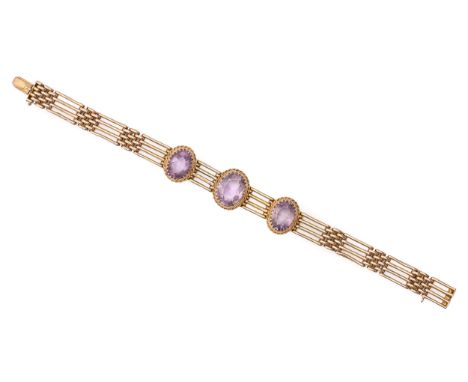An amethyst gate bracelet, early 20th c, in gold, 18.5cm l, marked 9c, 17.3g  Good condition