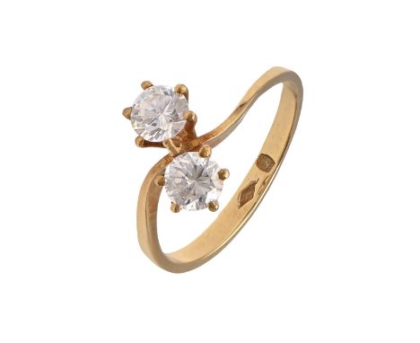 A white stone crossover ring, in gold, marked 750, 2.9g, size M  Good condition