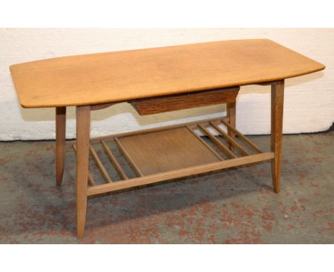 A mid century light oak coffee table, 1960s, with recessed drawer and slatted under tier, 45cm h; 42 x 91cm  Top slightly scr