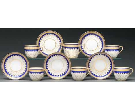 Five Derby Bute shaped teacups and saucers and one cream jug, c 1790, gilt Vandyke ground and cobalt blue borders, the jug 7.