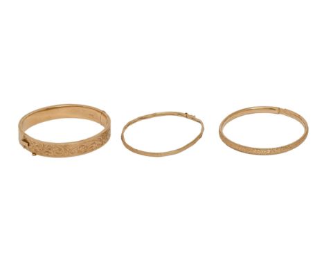 A 9ct gold bangle,&nbsp; 59mm (internal), Birmingham 1955 and two other gold bangles, one import marked, 24.5g  One bangle be