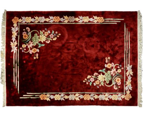 A Chinese red ground carpet, late 20th c, 270 x 360cm and two rugs (3) Good condition