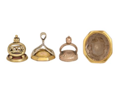 Three English giltmetal watch fob seals, early 19th c, comprising&nbsp; a George III giltmetal seal, possibly Irish, the foil