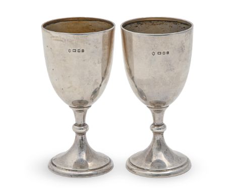 A pair of George V silver goblets, 11cm h, marks rubbed London 1926, 3oz 4dwt, on silver mounted stands  Light dents and poli