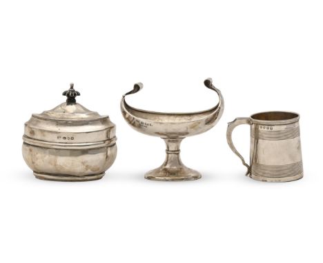 A George III silver christening mug, 68mm h, maker's mark rubbed, London 1815, a silver canoe-shaped footed dish, Birmingham 