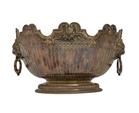 A Queen Anne silver punch bowl, with lion mask and ring handles, the partly gadrooned, undulating rim with scallop shells at 