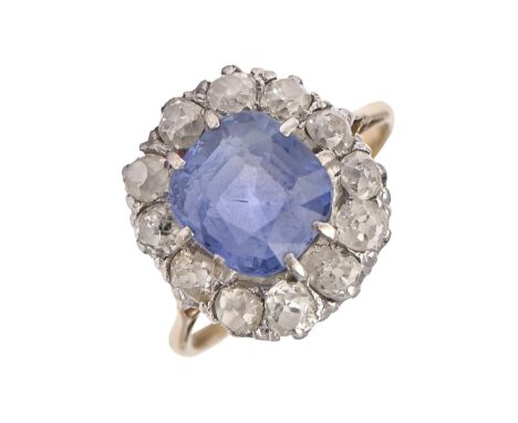 A sapphire and diamond ring, the cushion shaped sapphire 8 x 8mm, in surround of old cut diamonds, gold hoop, marks worn, 4g,