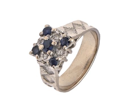 A sapphire and diamond ring, in 18ct white gold, textured hoop, Birmingham 1970, 5g, size J  Good condition