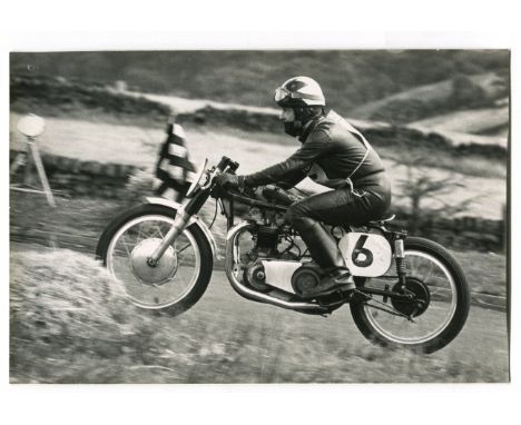PHOTOGRAPHS, MOTORING. A collection of approximately 49 large photographs of motor cycling, circa 1960, together with 13 phot