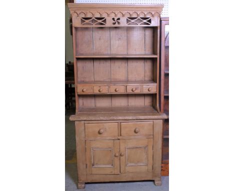 An early 20th century Irish pine kitchen dresserFiver short over two long drawers on cupboard base, 101cm wide; 194cm high48c