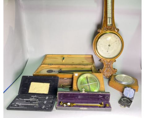 A collection of mostly early 20th century cased scientific items, including compass, barometer and sundry