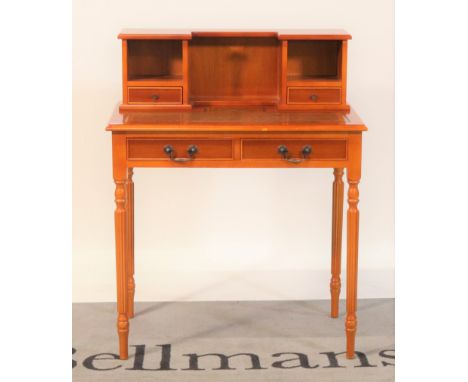 A Regency style yew wood writing deskTwo short drawers over reeded turned supports, 80cm wide; 90cm high