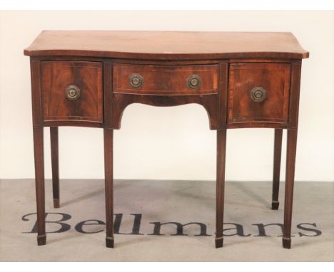 A George III mahogany serpentine sideboardThree frieze drawers on tapering square supports, 106cm wide; 80cm high