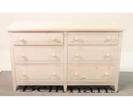 A modern white painted bedroom suite comprising a two door wardrobe112cm wide; 196cm high, a white painted side chest with si