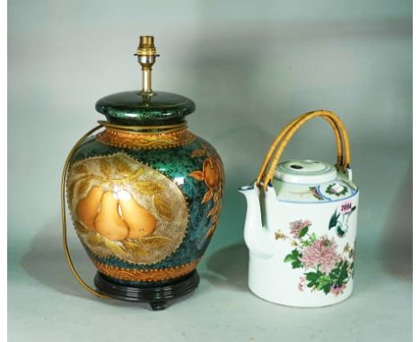 A modern Chinese ceramic tea pot25cm high, and a modern table lamp with gilt decoration, 48cm high (2)