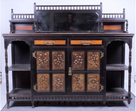 A 19th century aesthetic movement ebonised oak sideboardMirror back over two short drawers and embossed leather doors, 183cm 