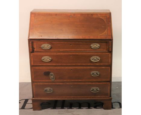 An 18th century style walnut bureauWith two long drawers on pad feet, 74cm wide; 100cm high