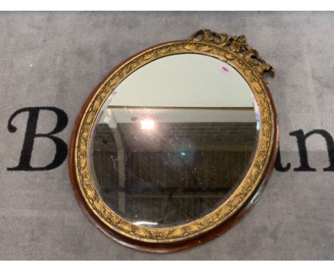 A late Victorian oval giltwood wall mirrorBevelled glass, 70cm wide; 85cm high