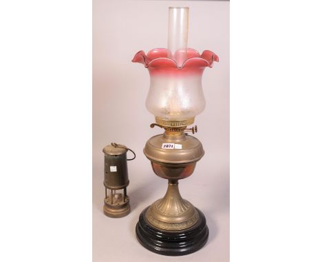 A Victorian brass oil lamp, with a coloured etched glass shade and an Ashington Colliery lamp22cm high (2)
