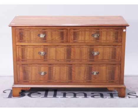 An early 20th century walnut chestTwo short over two long drawers on bracket feet 106cm wide; 69cm high
