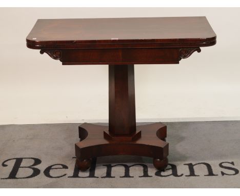 An early Victorian rosewood foldover card tableOctagonal column on bun feet, 92cm wide; 75cm high