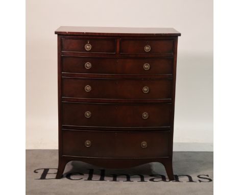 A George III style mahogany bowfront chestOf two short over four long graduated drawers, 83cm wide; 104cm high