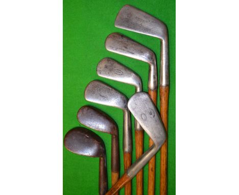 7x Smooth faced irons including a James Braid deep faced^ square toed mashie^ a Carruthers short hosel bore through mashie^ a