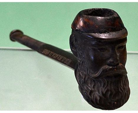 W G Grace shaped Centuplico wooden pipe having a W G Grace head bowl^ the stem is a carved as a bat with a ball to the base^ 