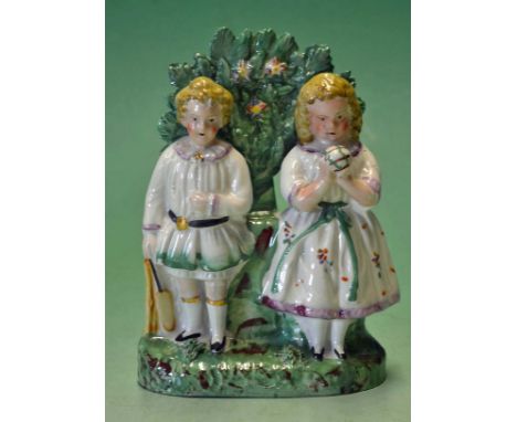 Original Vic Staffordshire ceramic cricket group of figures - comprising a boy holding a cricket bat wearing a white smock an