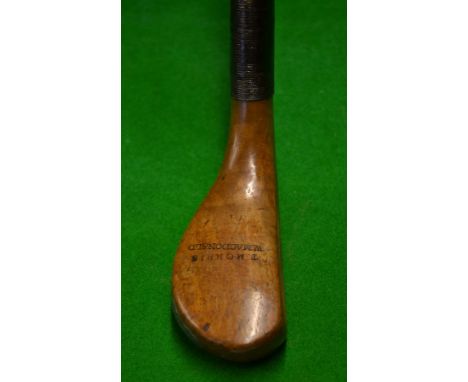 Late T Morris scare neck putter in light stained dogwood^ fitted with a whole cane shaft^ the crown of the head is additional