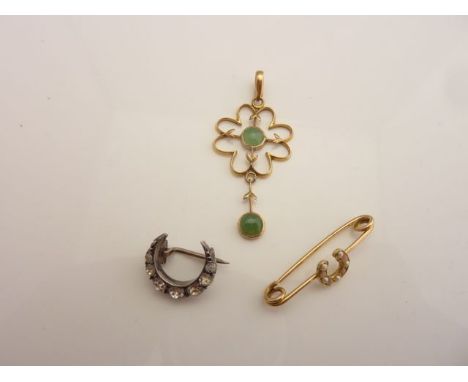 An unmarked gold safety pin brooch, centred with a horseshoe motif, set with alternating pearls and coral; an unmarked gold p