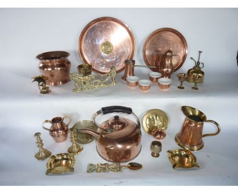 A collection of copper and brassware to include an unusual copper kettle, a jug with beaten copper bowl with brass rim and fo