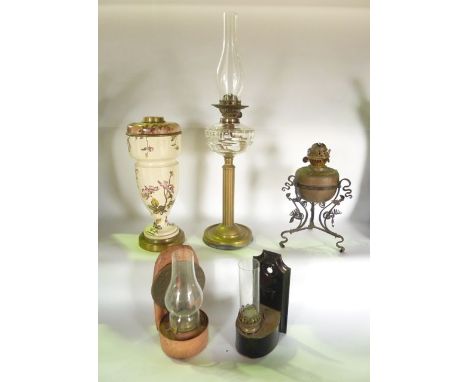 A selection of vintage lighting effects to include an oil lamp with fluted brass column base and cut clear glass fount, an oi