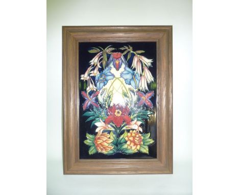 A Moorcroft limited edition tile of rectangular form designed by Philip Gibson in the Hidcote pattern, with impressed mark to